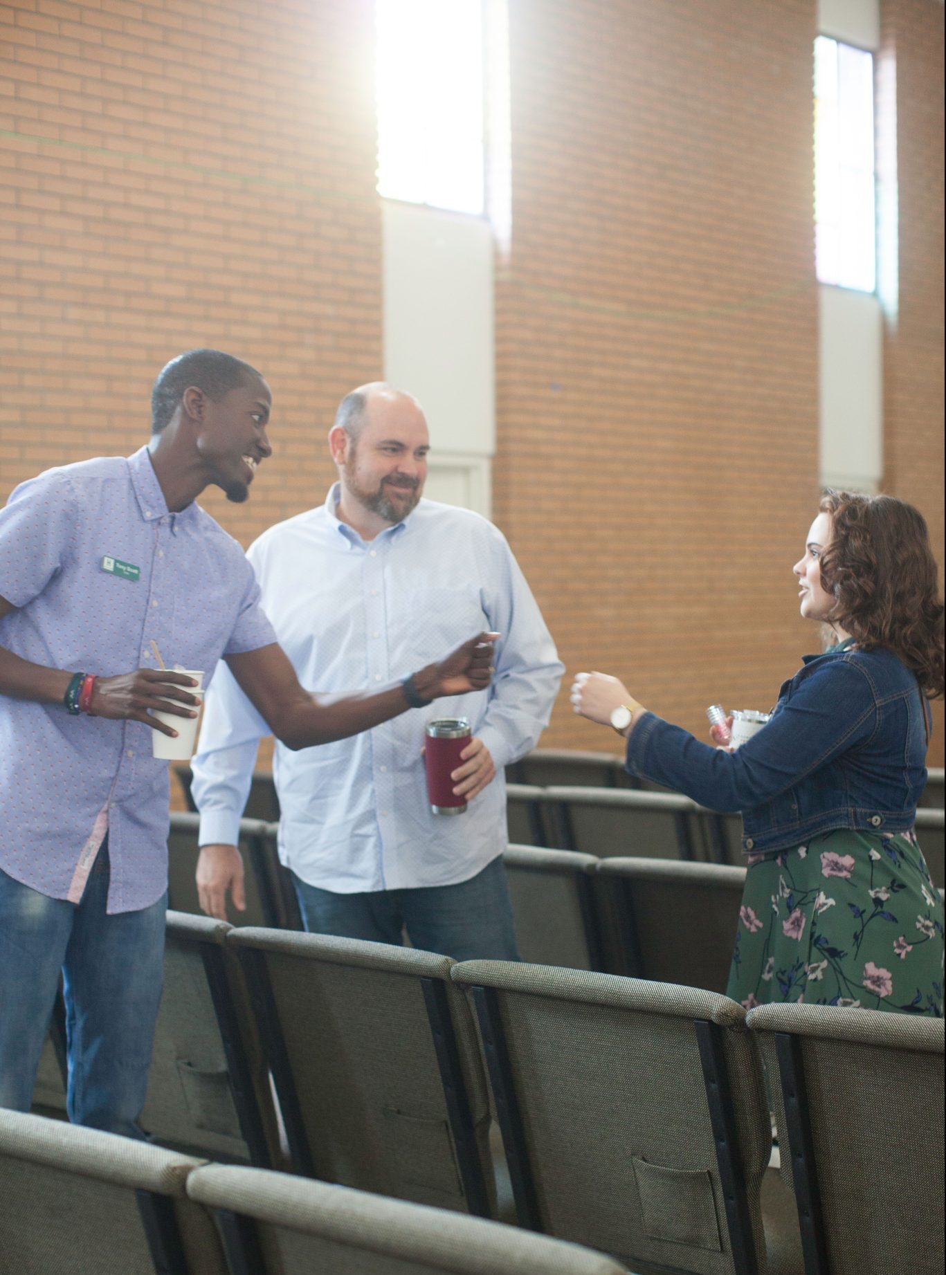 Friends talking and greeting one another at Hope Bible Church